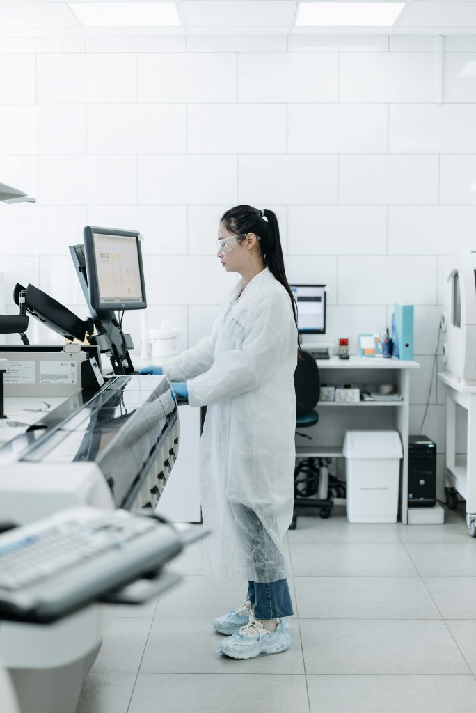 Lab scientist conducting research in a high-tech laboratory environment.